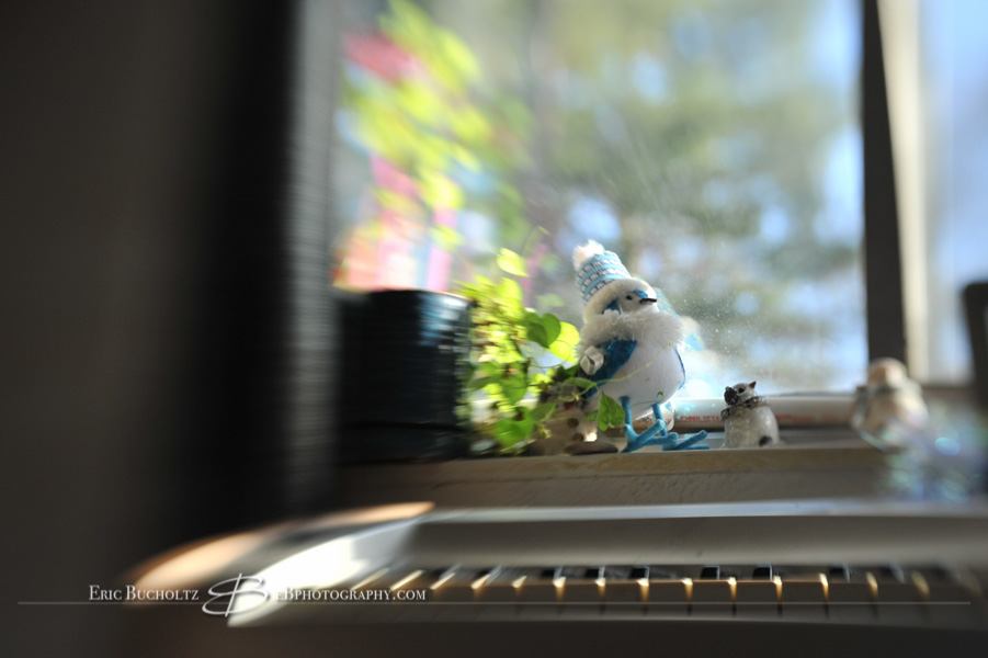 Lensbaby tilt shift manual focus lens image, sunlight and window decor by piano keys