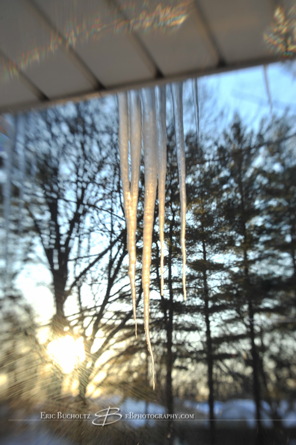 Lensbaby tilt shift manual focus lens image, icicles in February afternoon sunlight colors